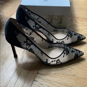 Black lace Manolo Blahnik pumps.